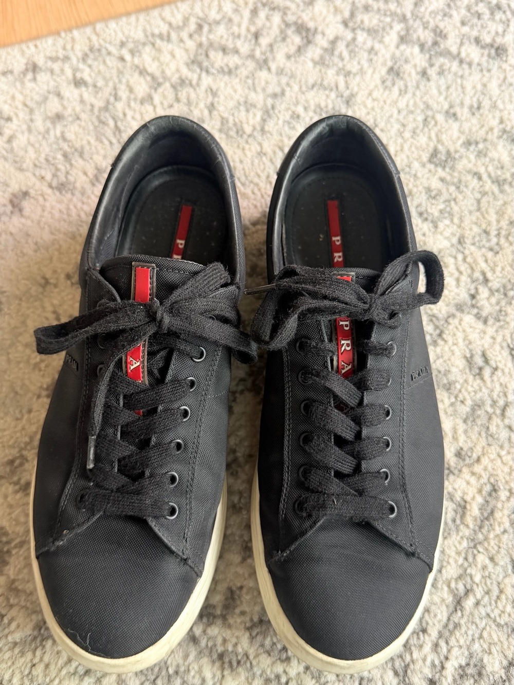 Prada Black Men's Low-Top Sneakers with Red Logo Stripe